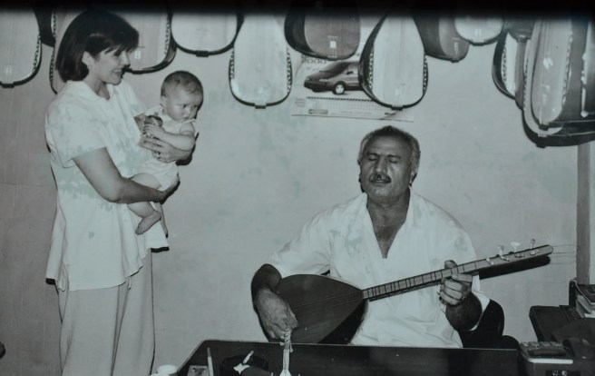 14 years ago, baby and me.  This kind man plays his Turkish Saz for us.
