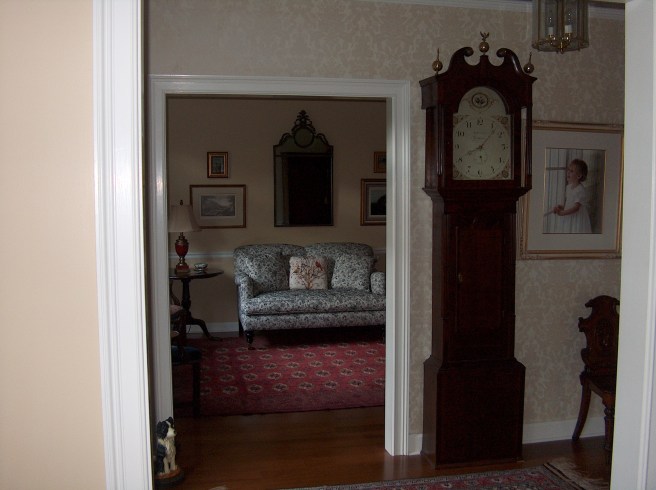 An 1820 Longcase clock from Leyburn, England stands sentry at our door.