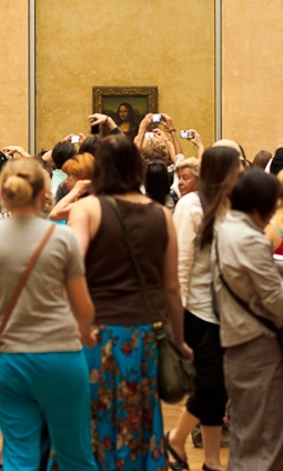 At the Louvre--is that the Mona Lisa or Mick Jagger? Am I in a moshpit or museum?